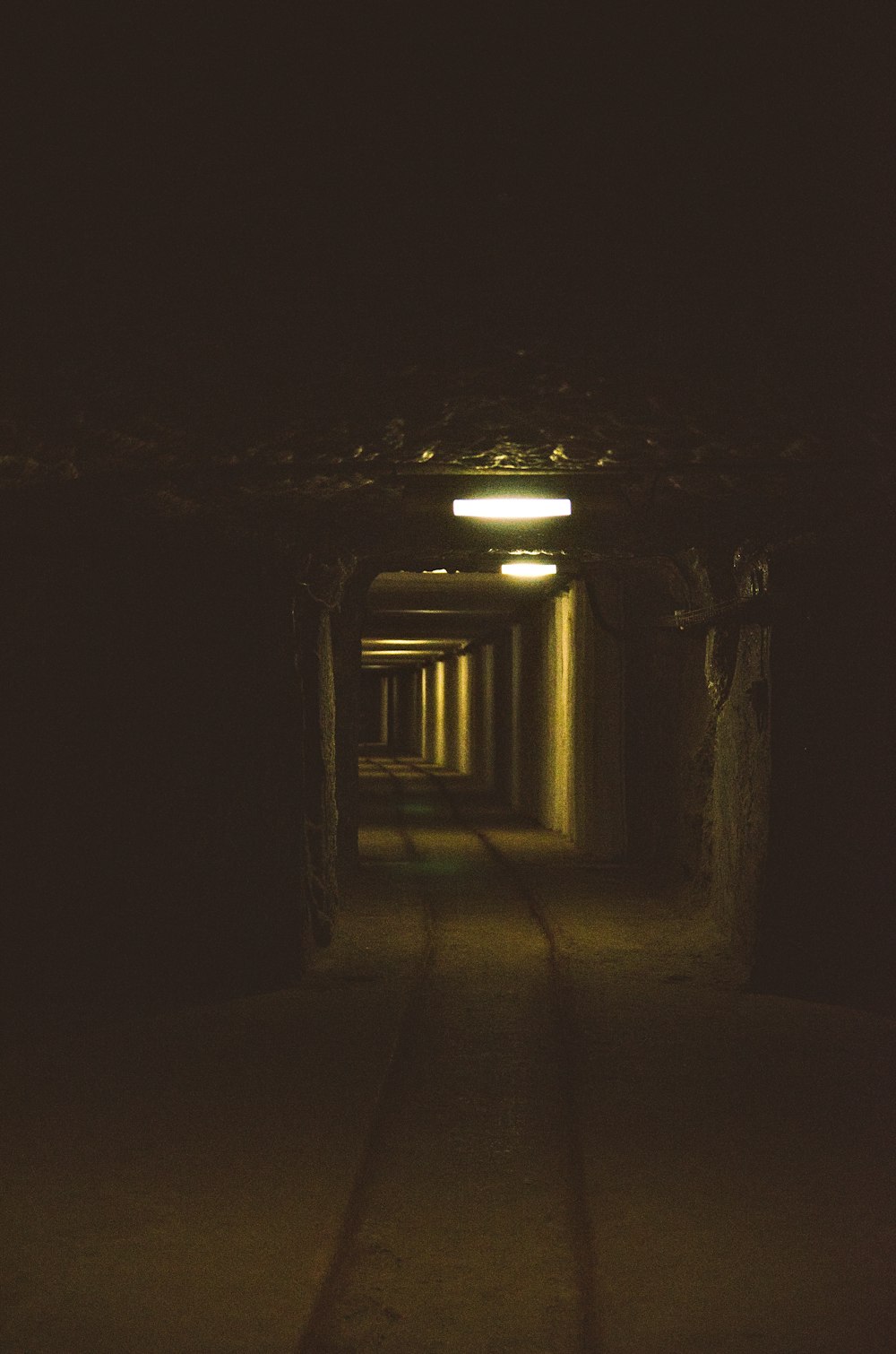 a dark tunnel with a light at the end