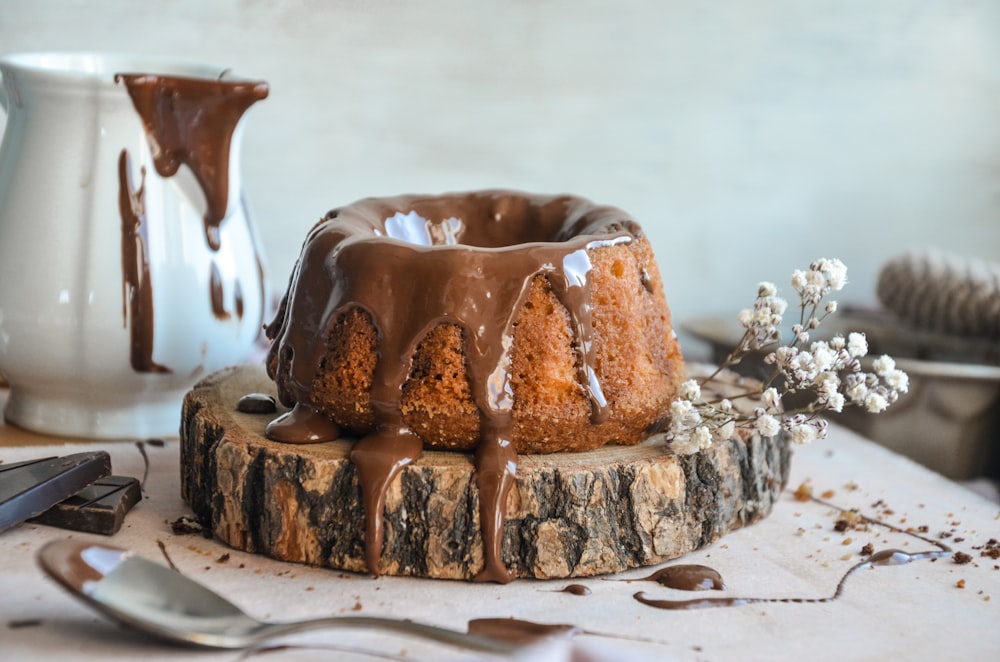 a bundt cake with chocolate icing on a table