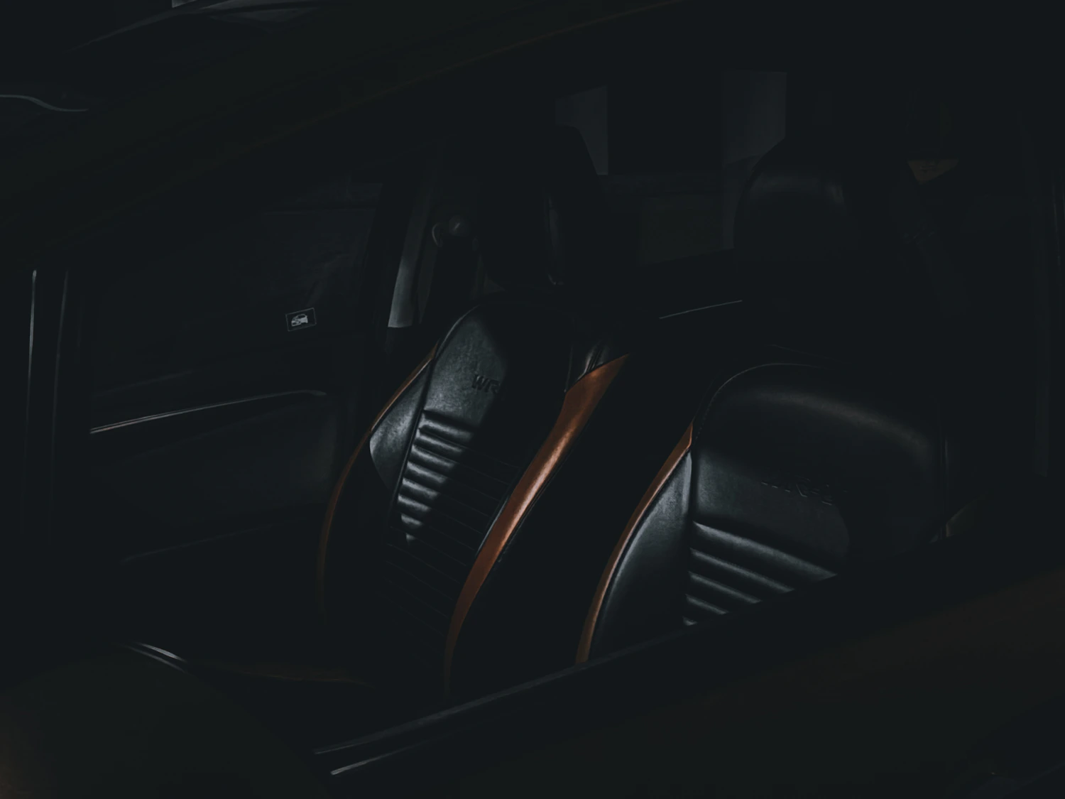 Black leather seats inside a vehicle