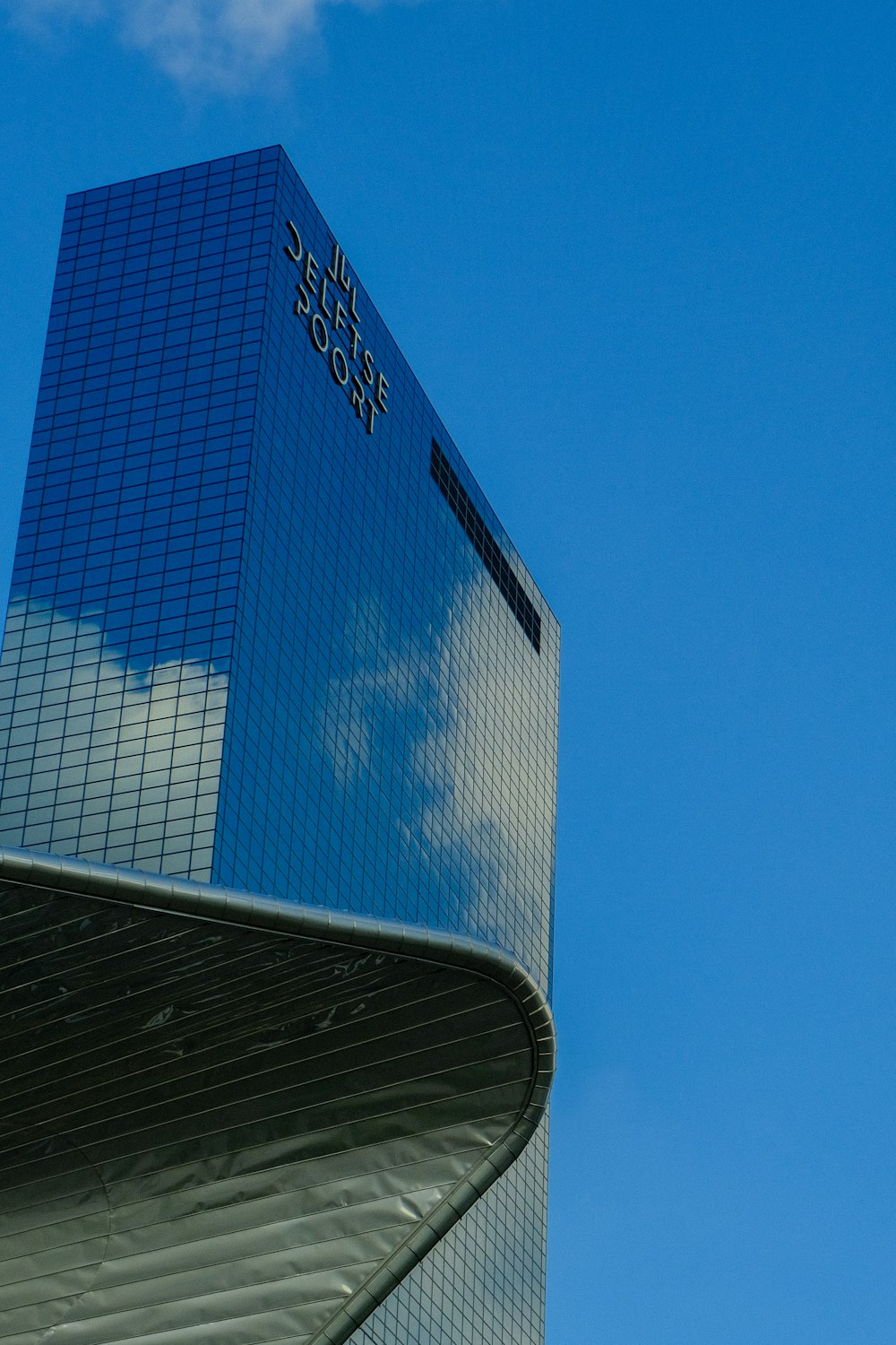 a very tall building with a sky background