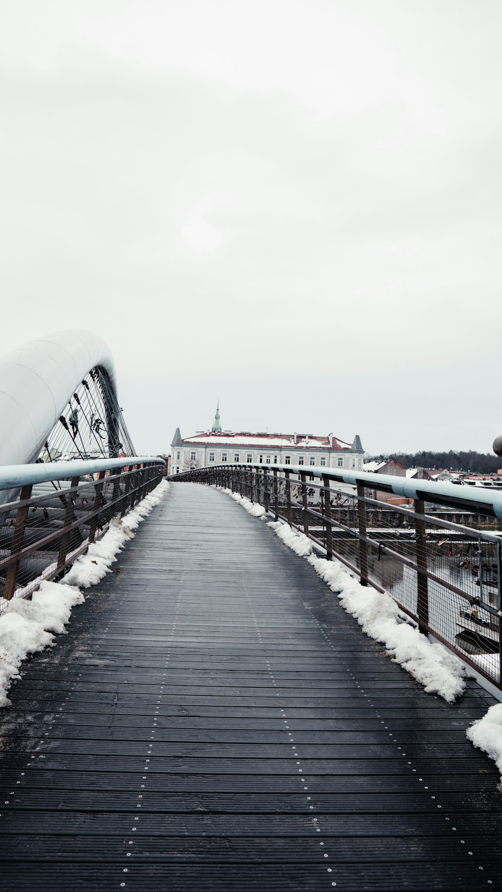 a bridge that has snow on the ground