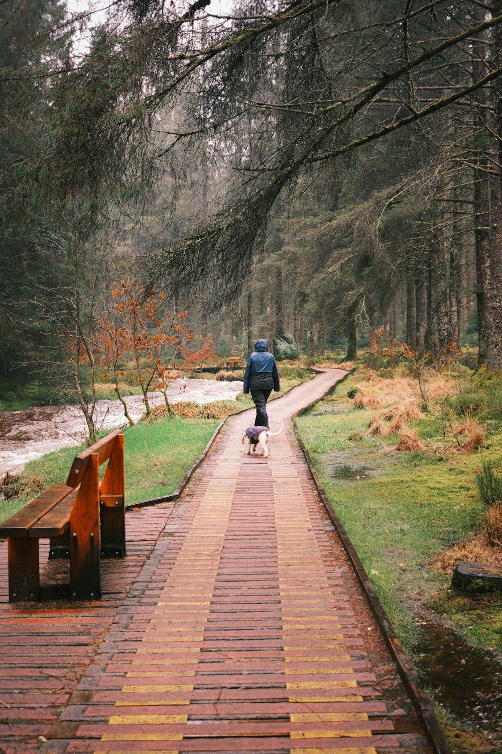 a man riding a skateboard down a brick walkway