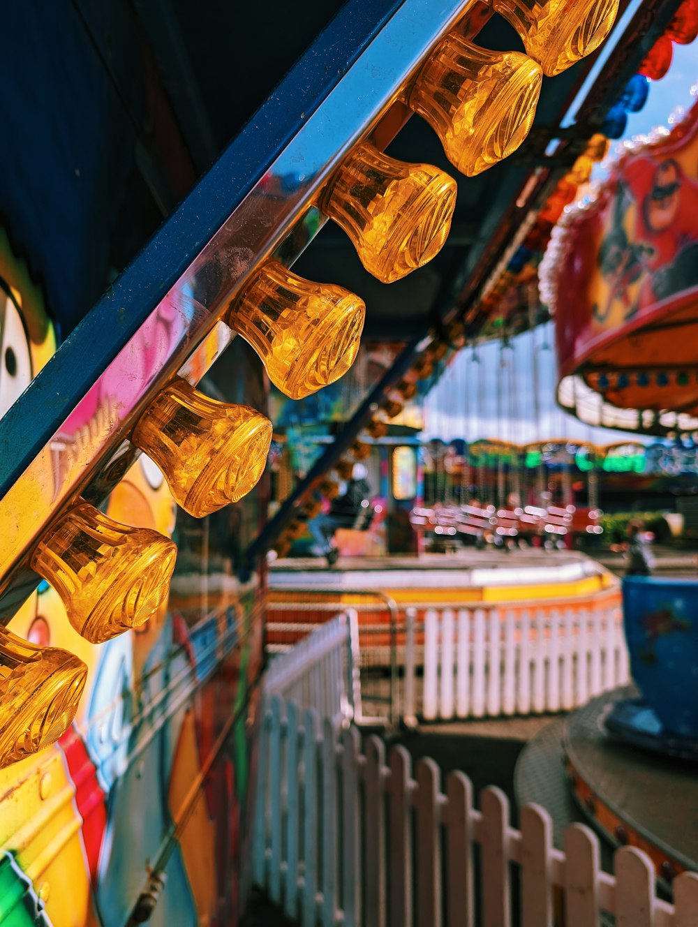 a carnival ride at a carnival with carnival rides in the background