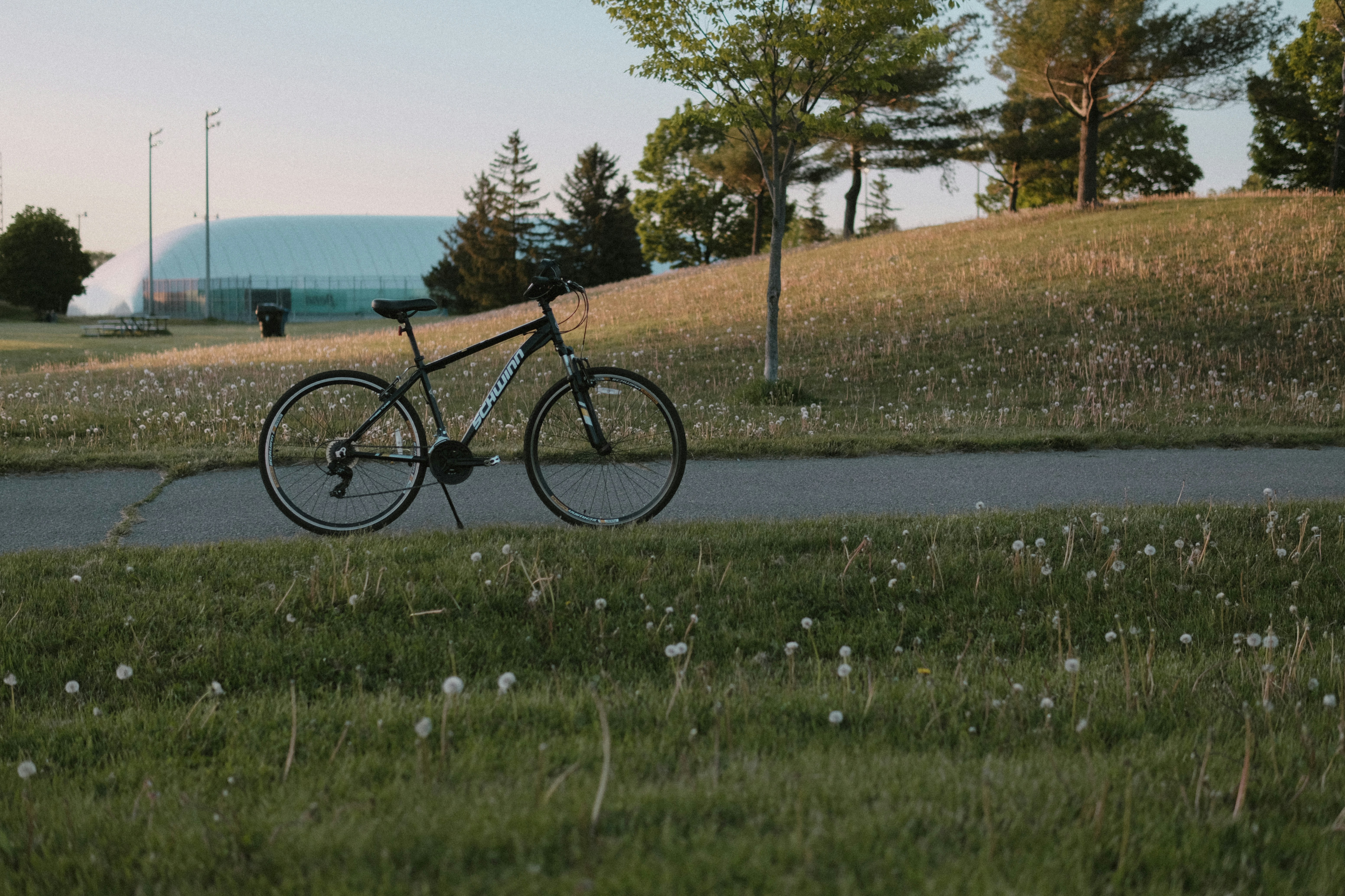 a bicycle parked on the side of a road