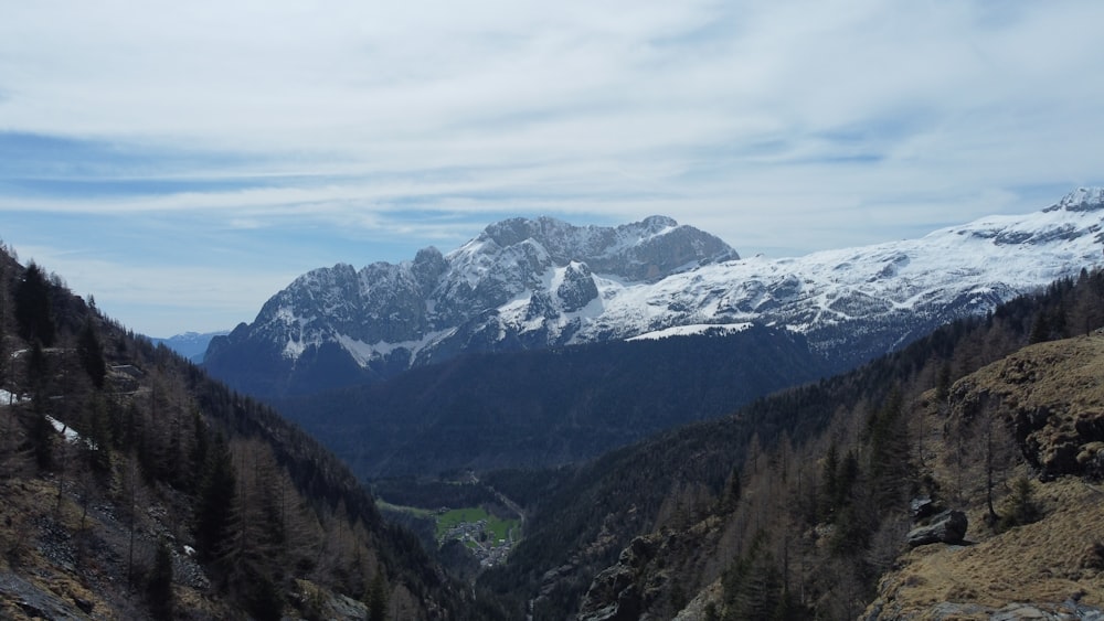 a view of a valley with mountains in the background