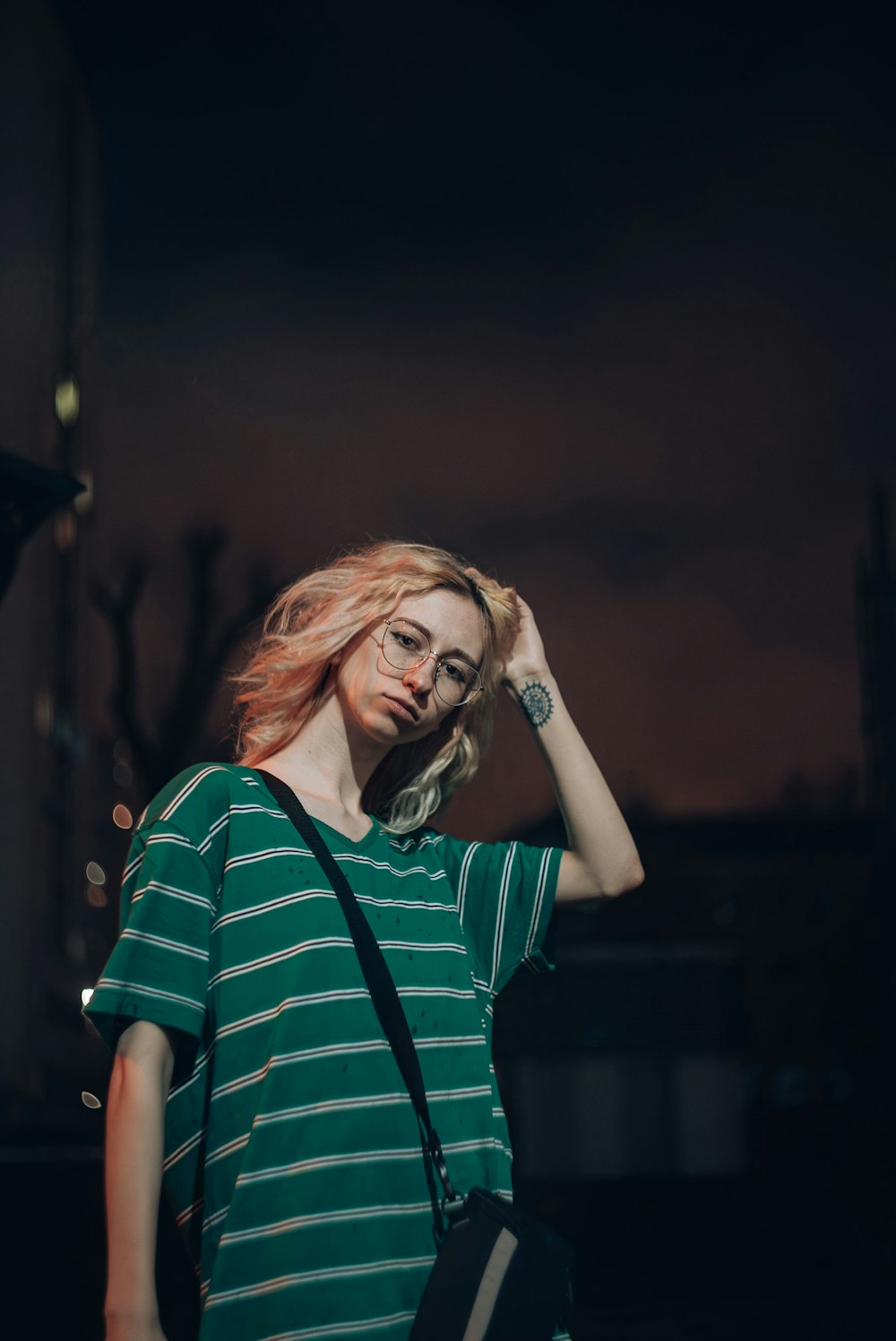 a woman in a green and white striped shirt