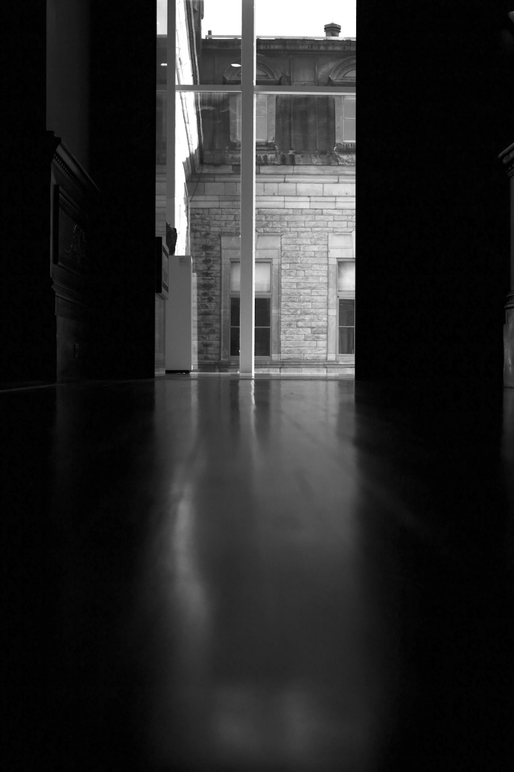 a black and white photo of an open door