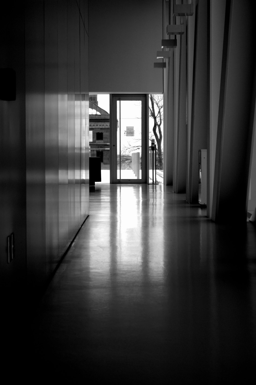 a black and white photo of a hallway