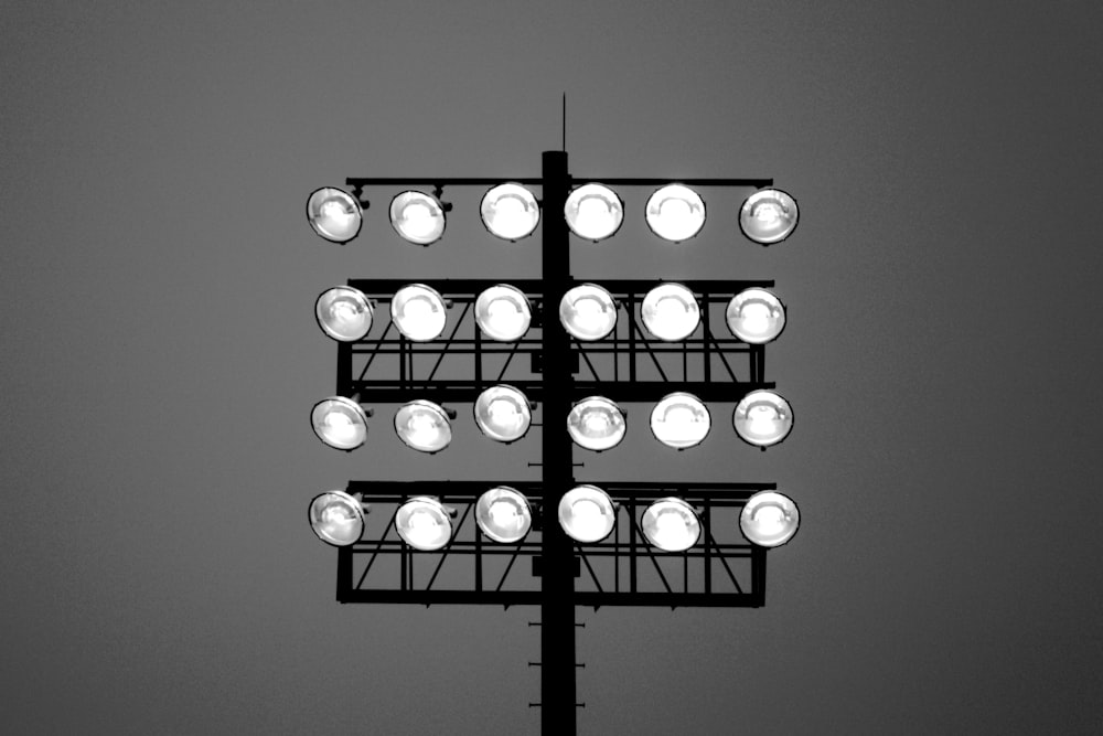 a black and white photo of a street light