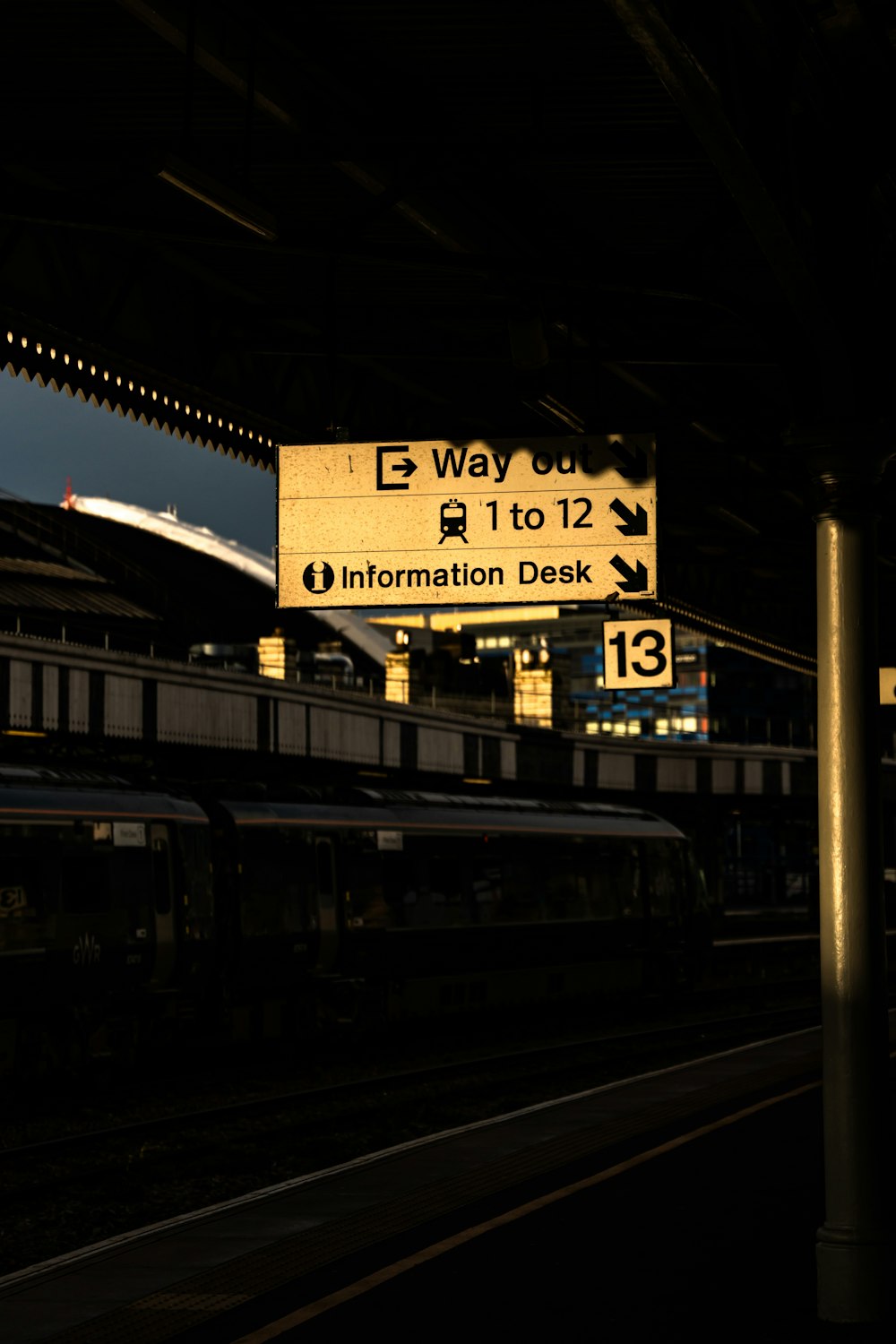 a train station with a train on the tracks