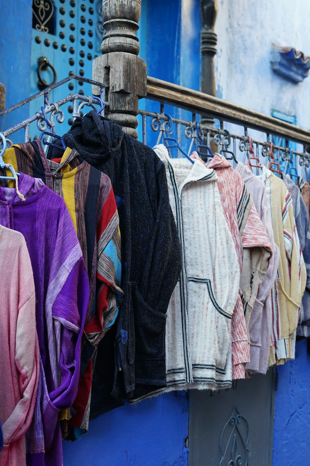 a bunch of clothes hanging on a clothes line