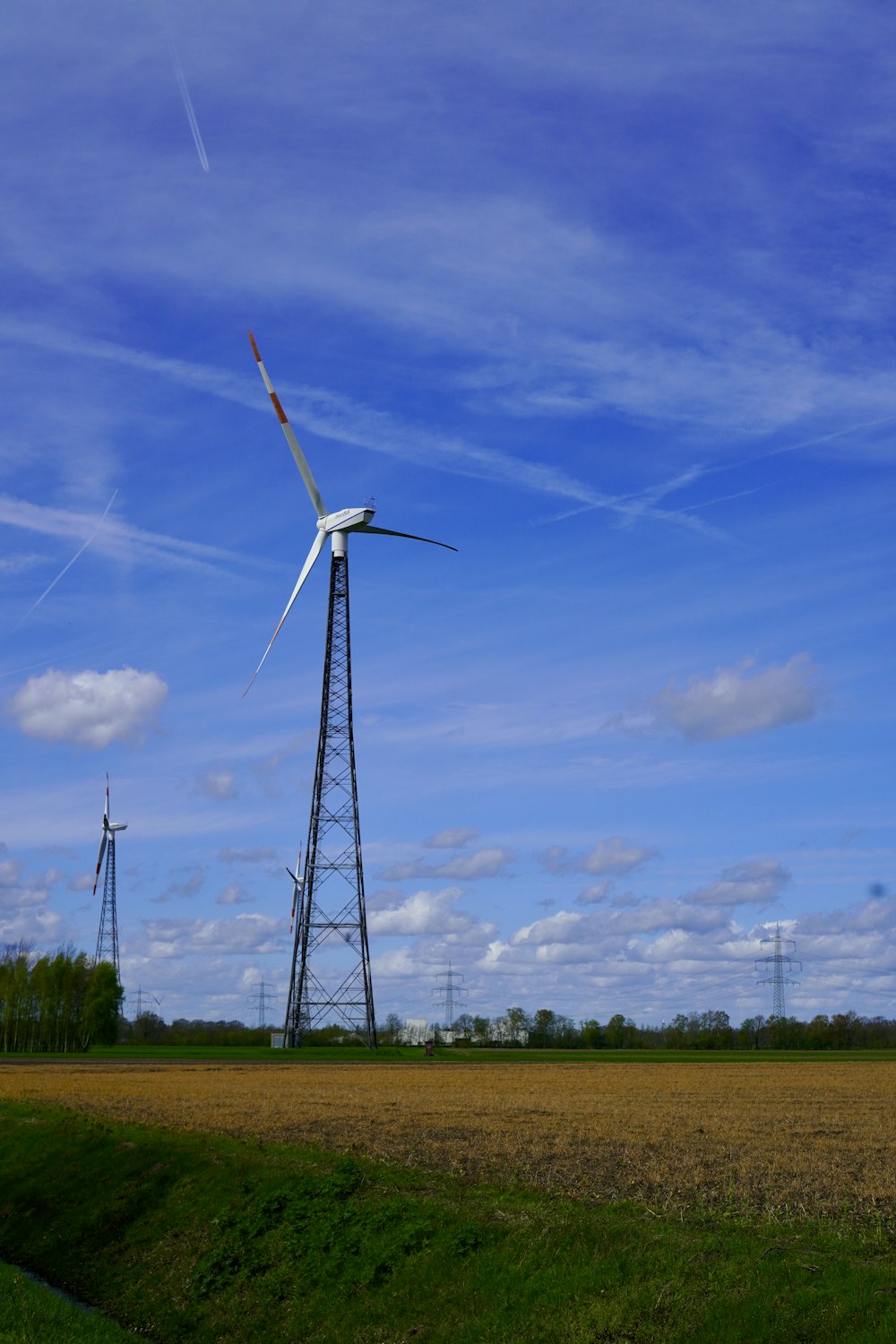 a wind turbine in the middle of a field