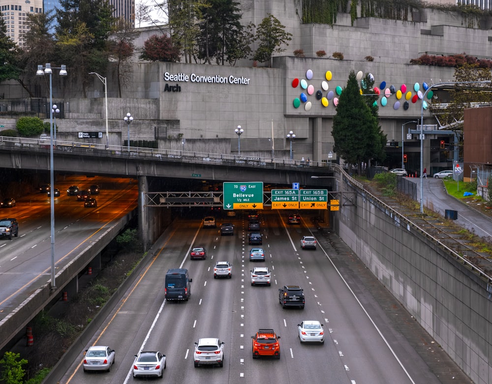 a freeway filled with lots of traffic under a bridge