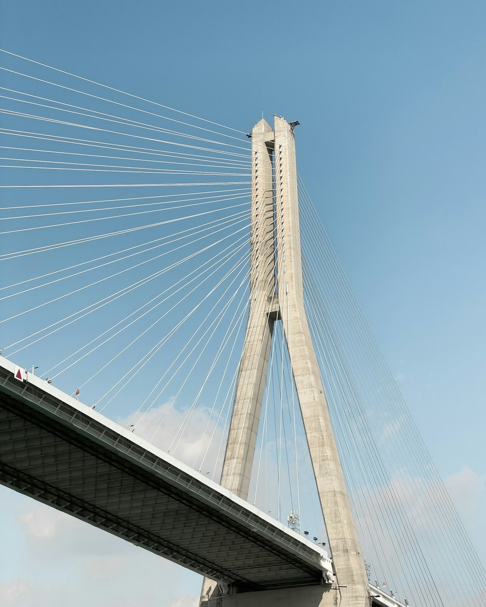 a very tall bridge with a very tall tower