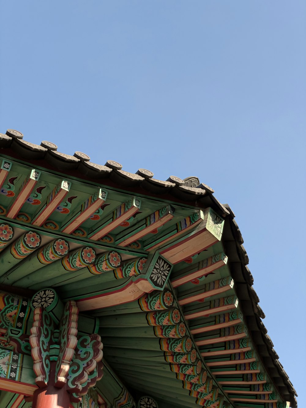 the roof of a building with a clock on it