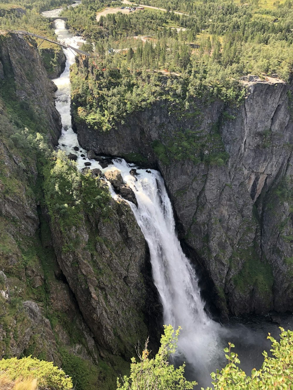 a waterfall in the middle of a canyon