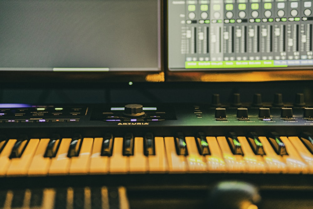 a close up of a keyboard in front of a sound board