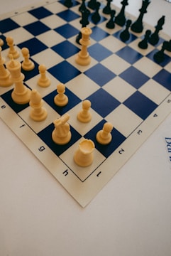 a close up of a chess board with pieces on it