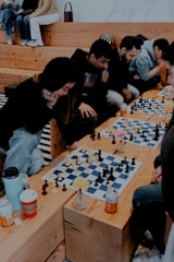 a group of people playing a game of chess