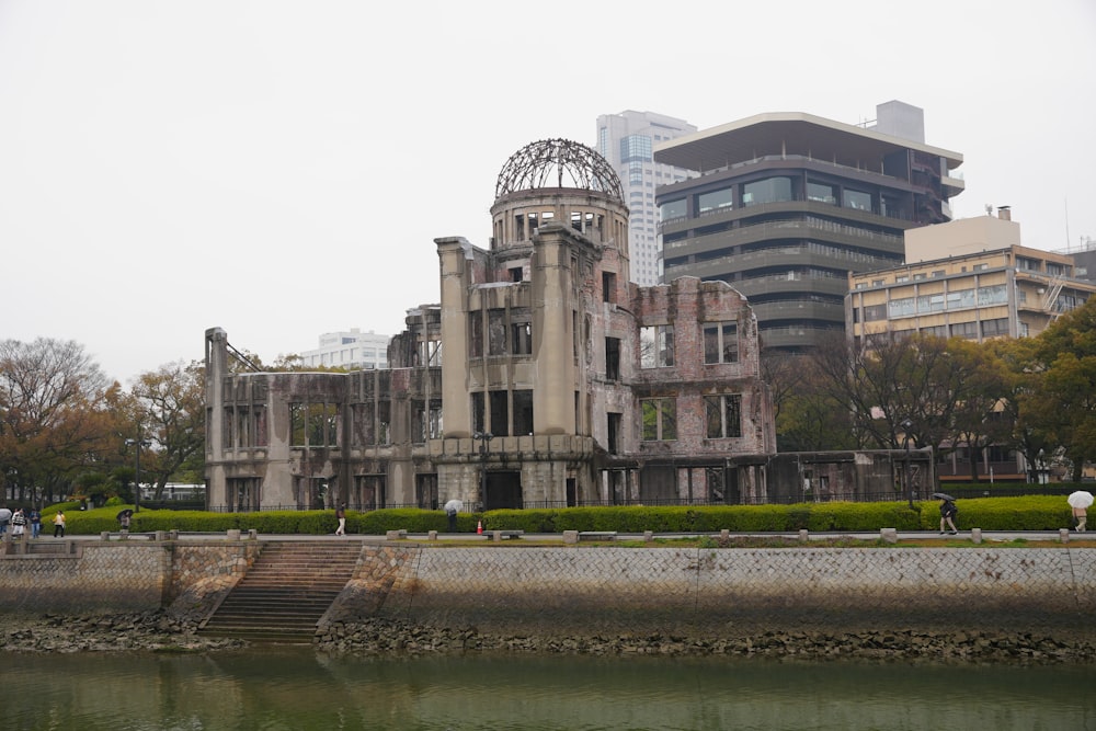 a large building sitting next to a body of water