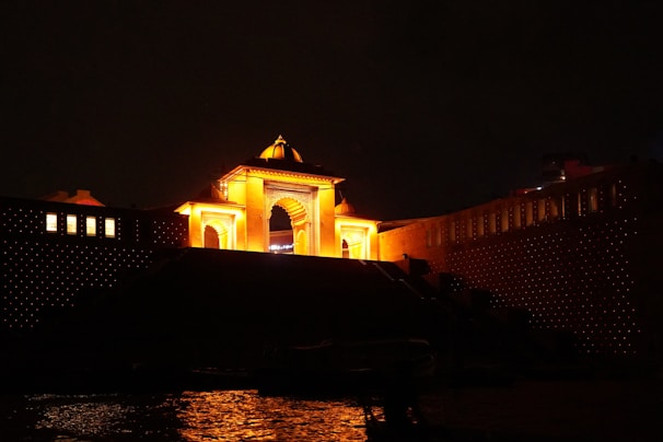 a clock tower lit up in the night sky