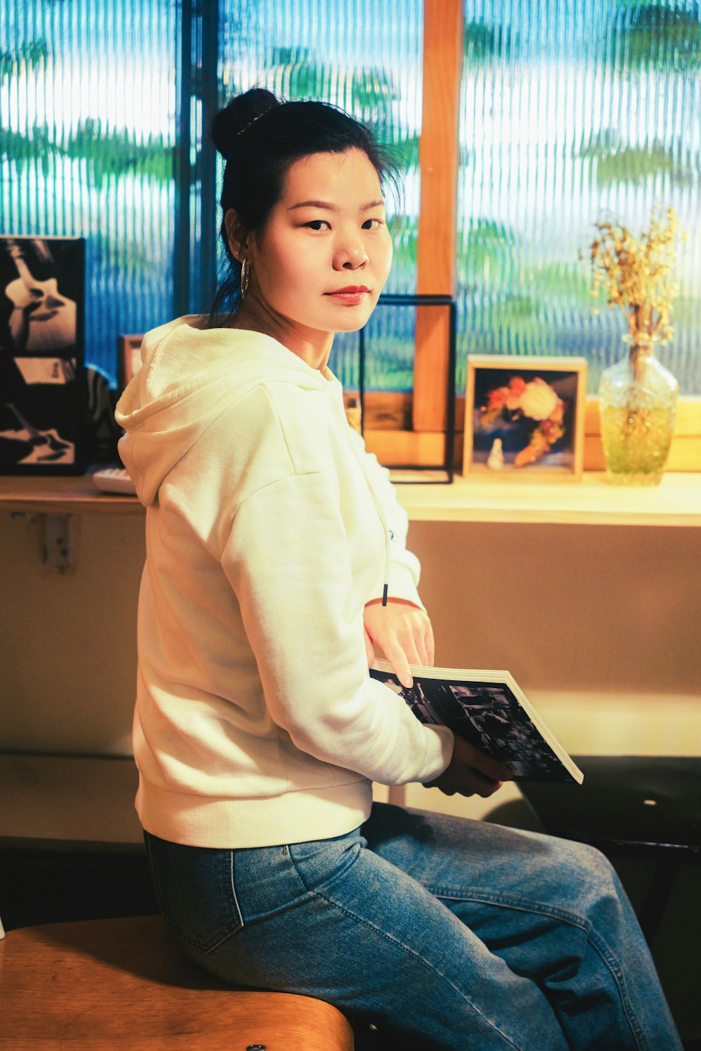 a woman sitting on a table with a laptop