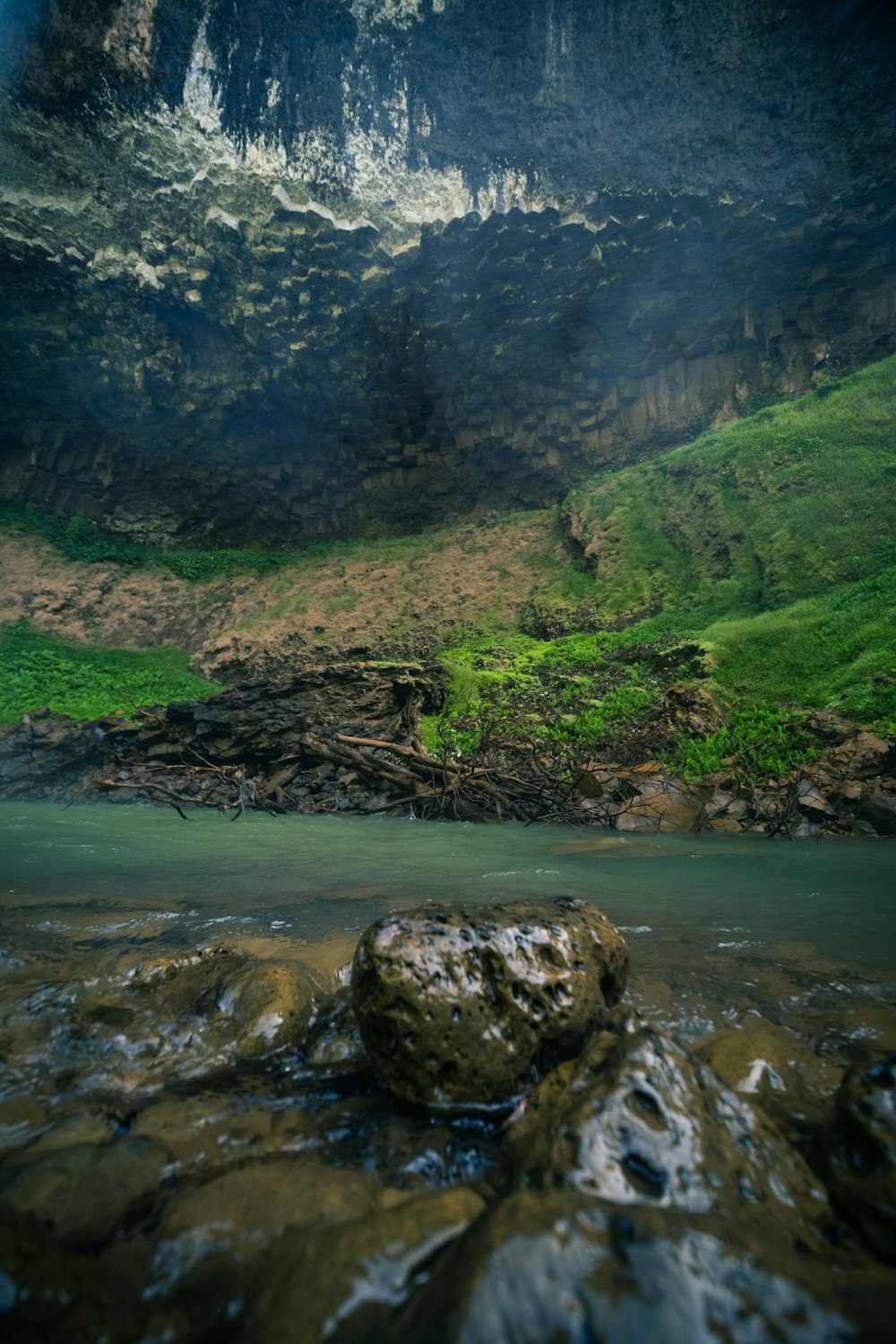 a rock in the middle of a body of water