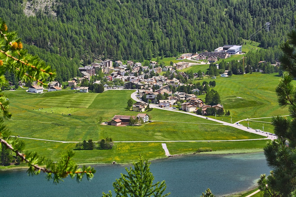 a scenic view of a small town in the mountains