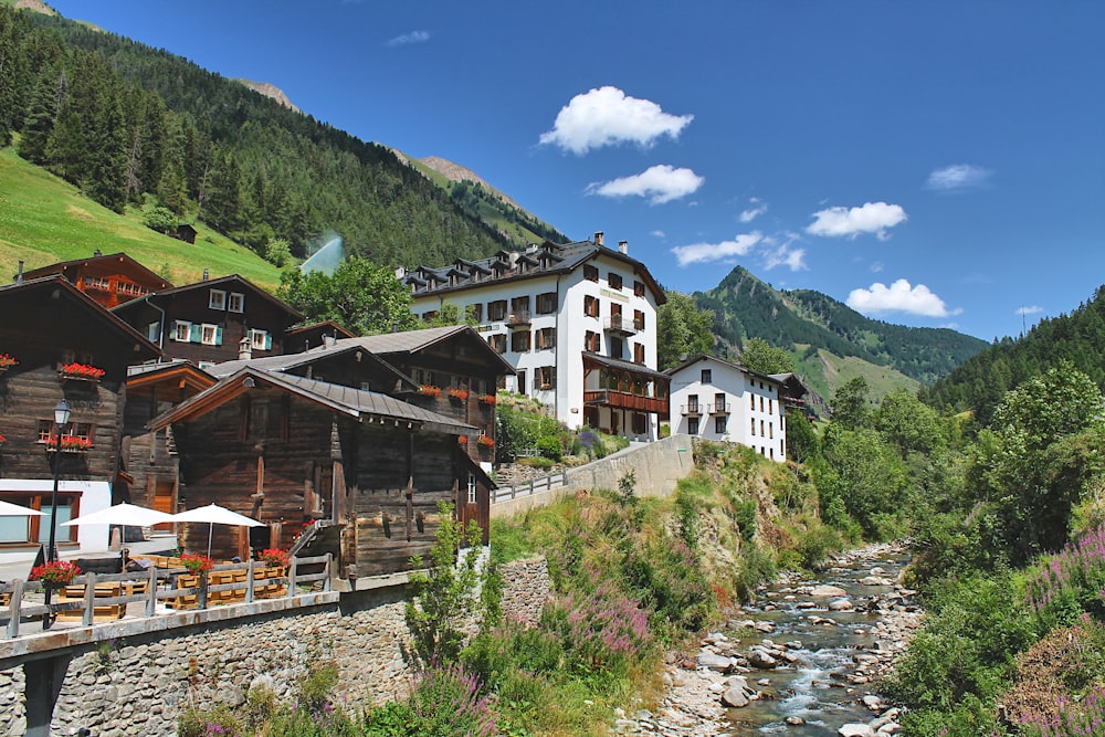 a river running through a lush green hillside