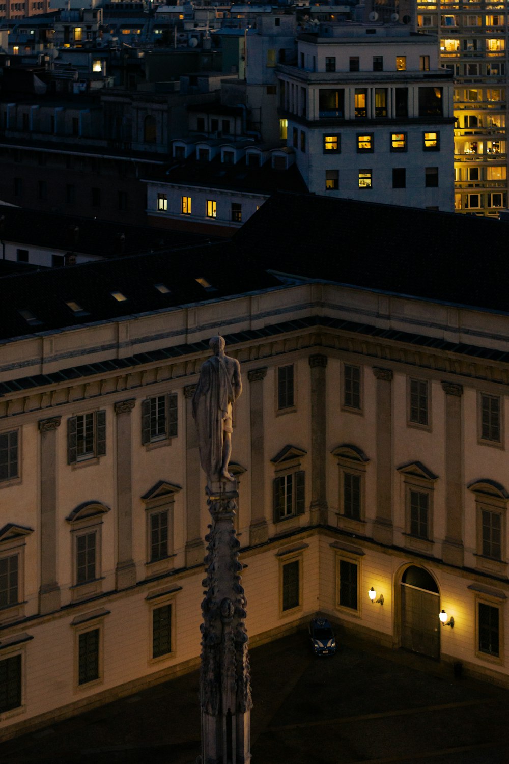 a clock tower in front of a large building