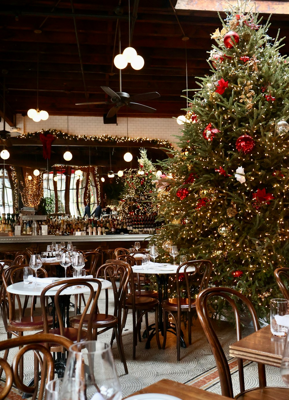 a decorated christmas tree in a restaurant