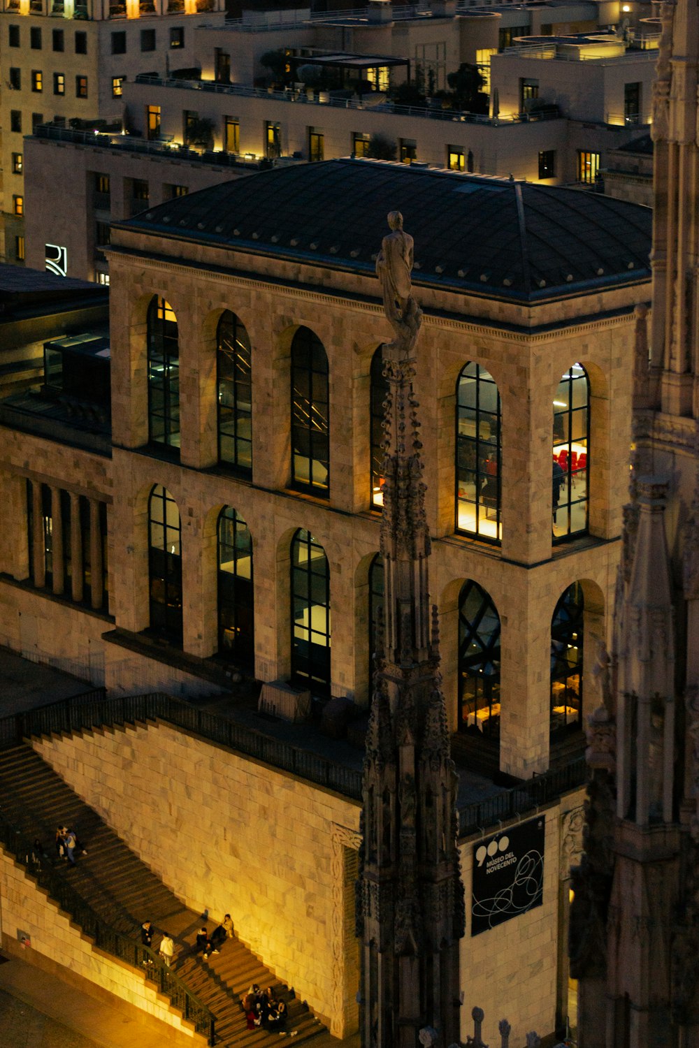 a very tall building with a clock tower in the middle of it