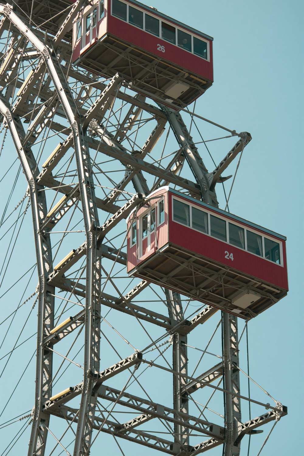 a ferris wheel with two cars on top of it