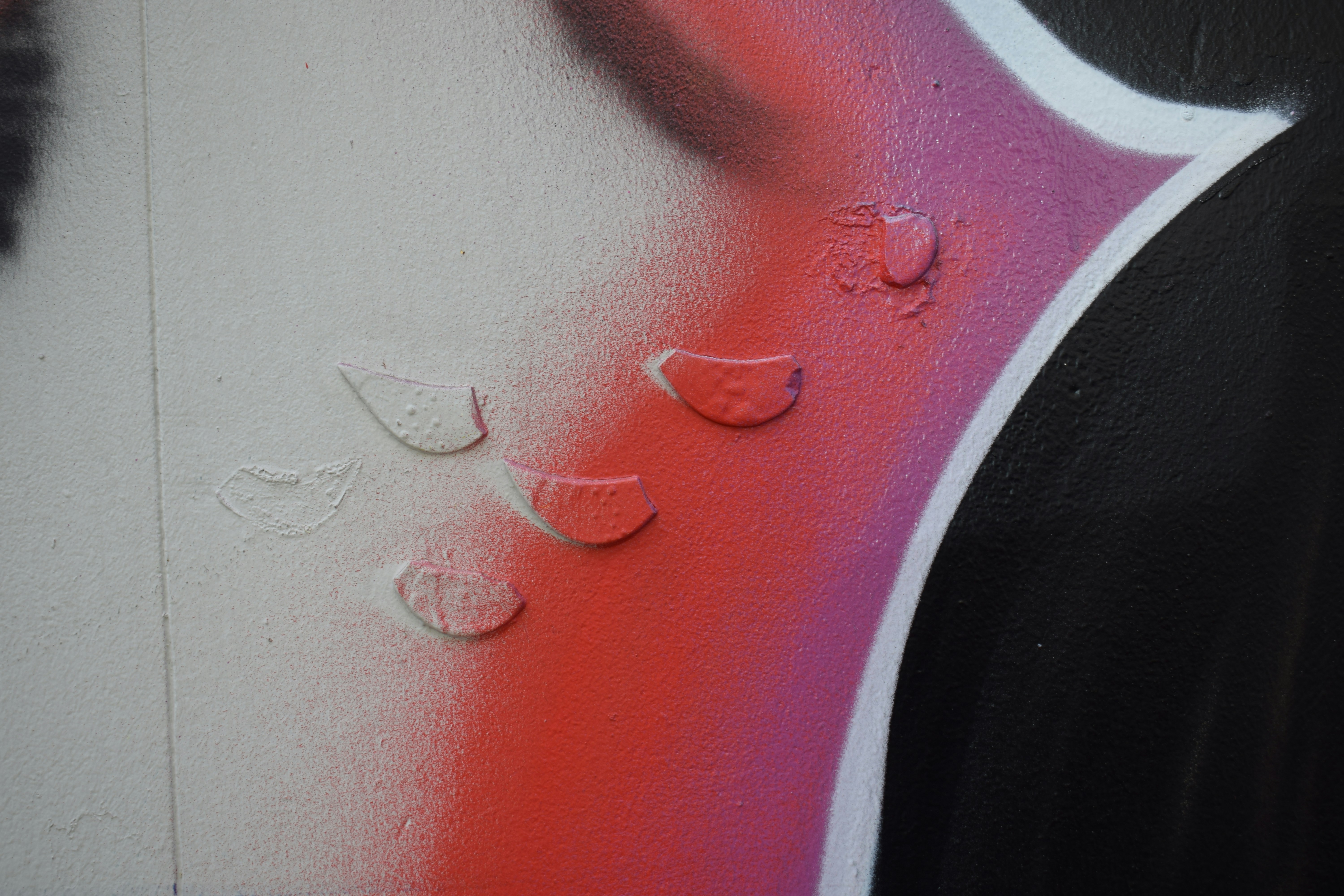 a close up of graffiti on a wall