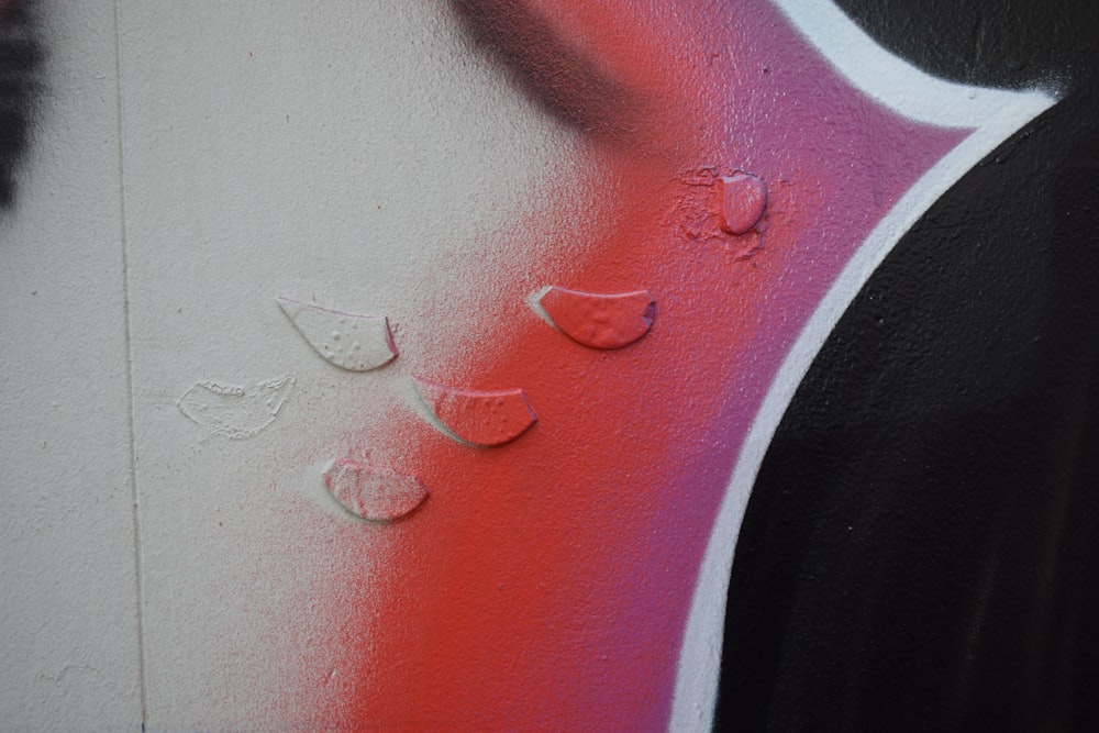 a close up of graffiti on a wall