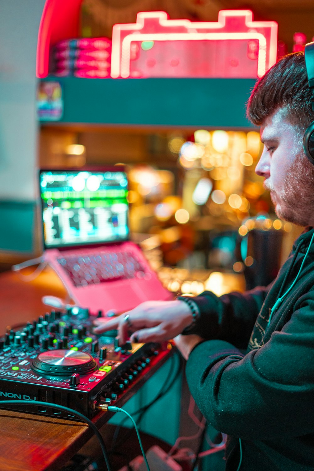 a man wearing headphones is playing music