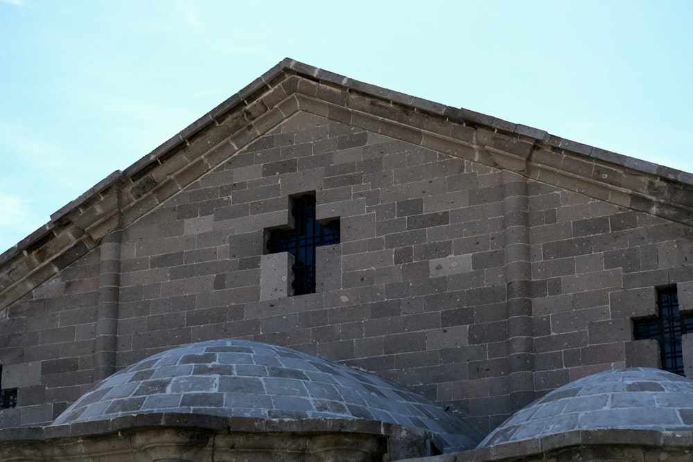 a church with a cross on the side of it