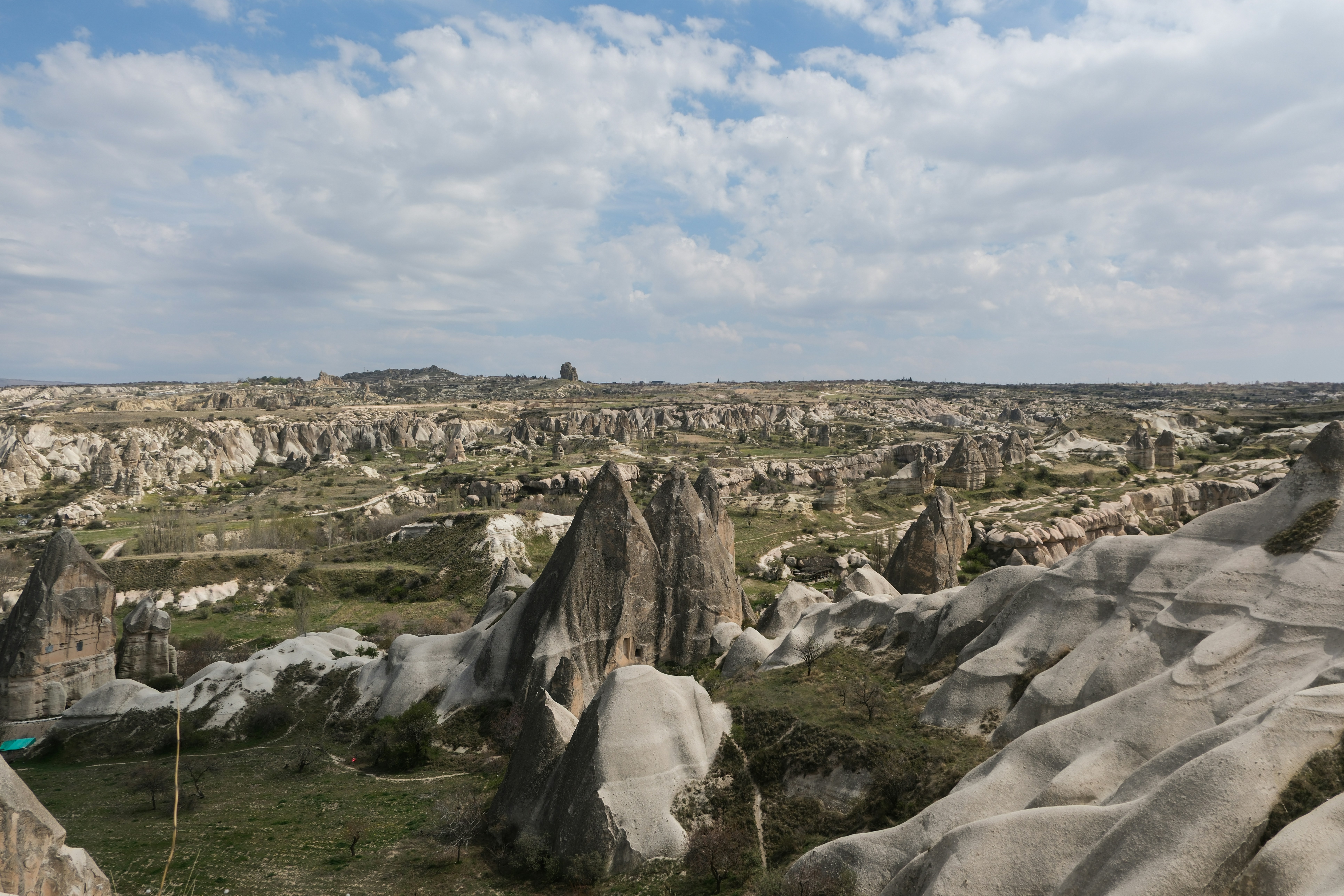 a view of a rocky landscape from a distance - a-view-of-a-rocky-landscape-from-a-distance-7Uwrr-ERq6o