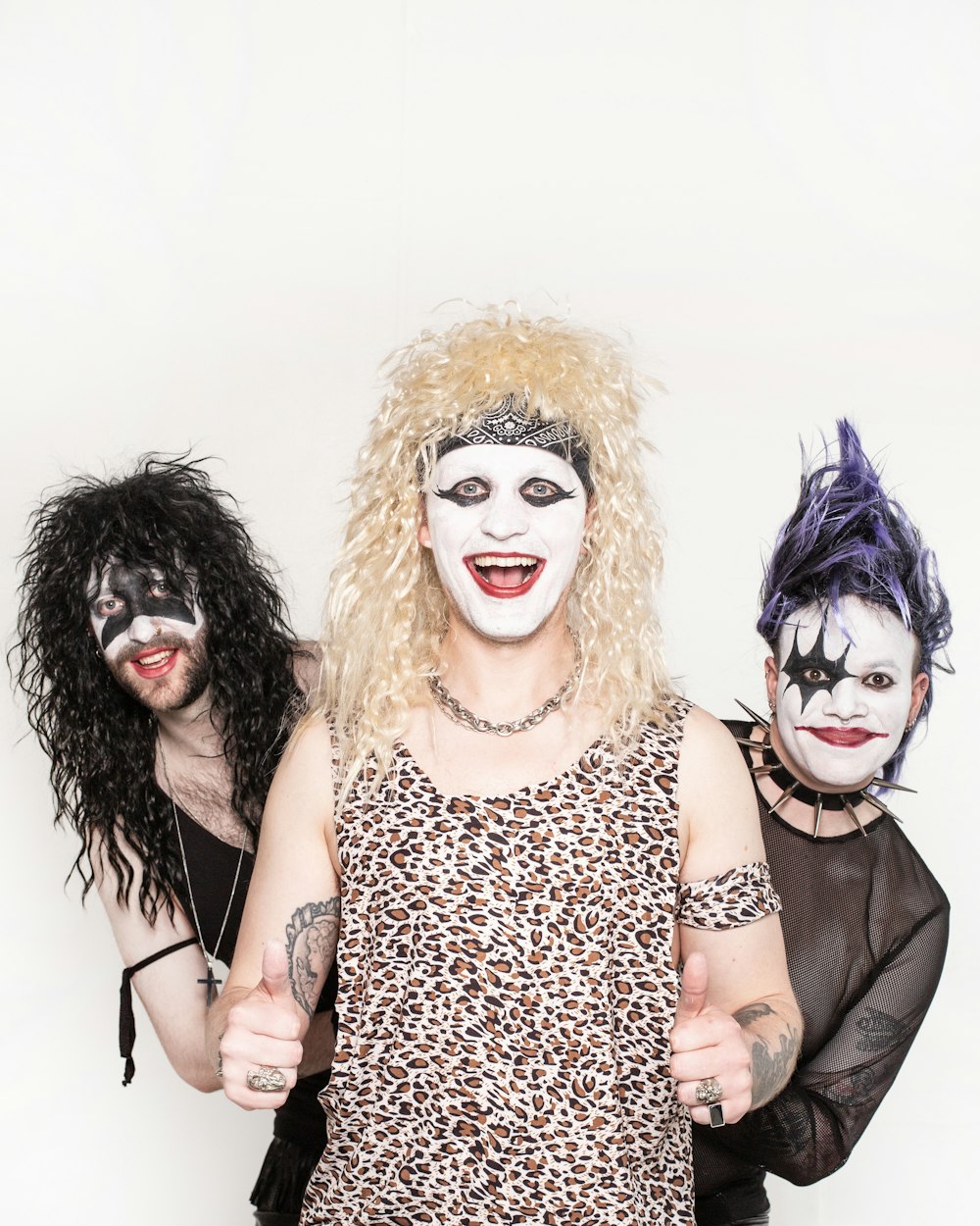 a group of people with makeup on their faces