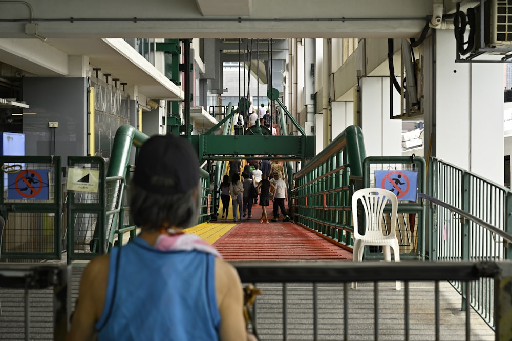 a group of people walking down a walkway