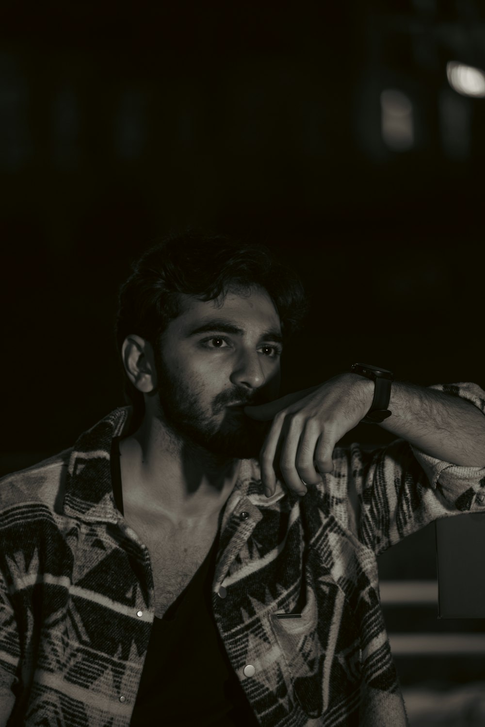 a man with a beard is posing for a picture