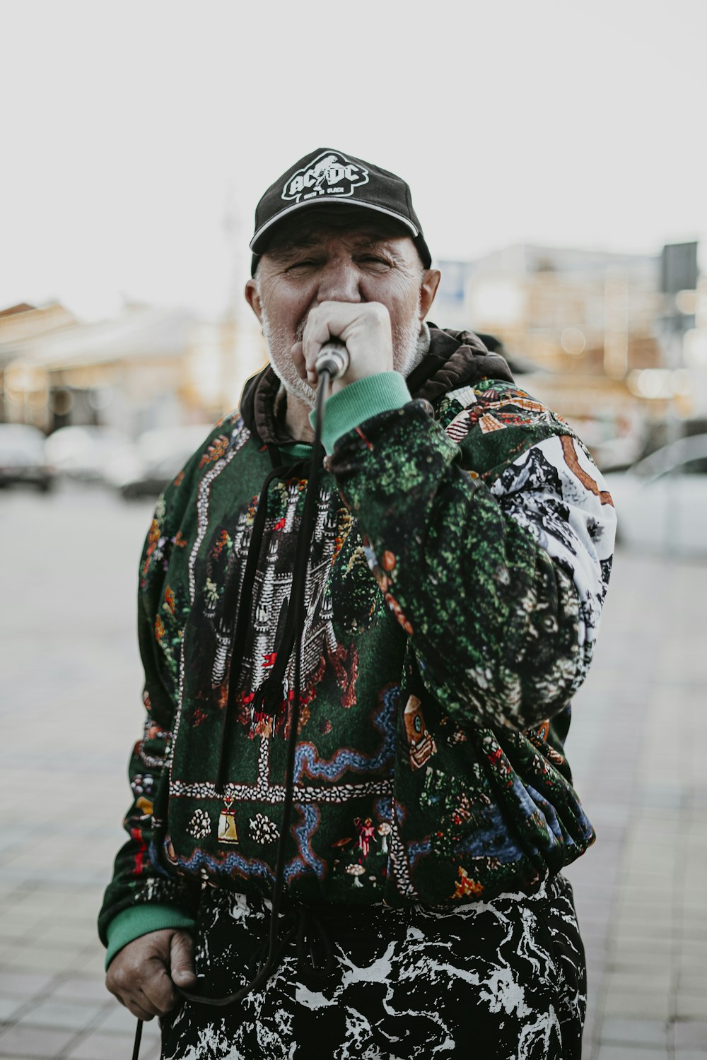 a man standing on a sidewalk with his mouth open