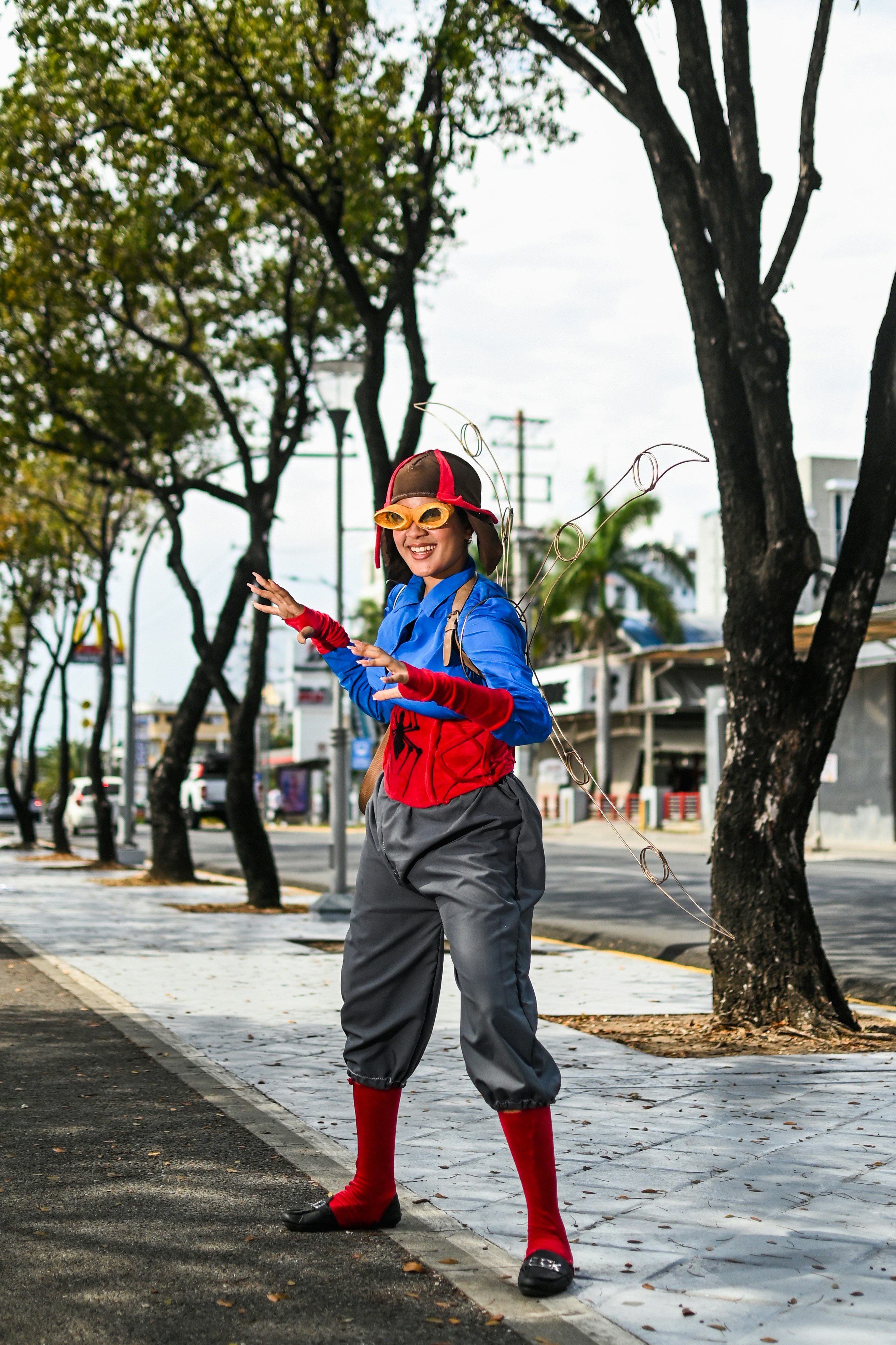a person in a costume is standing on a sidewalk