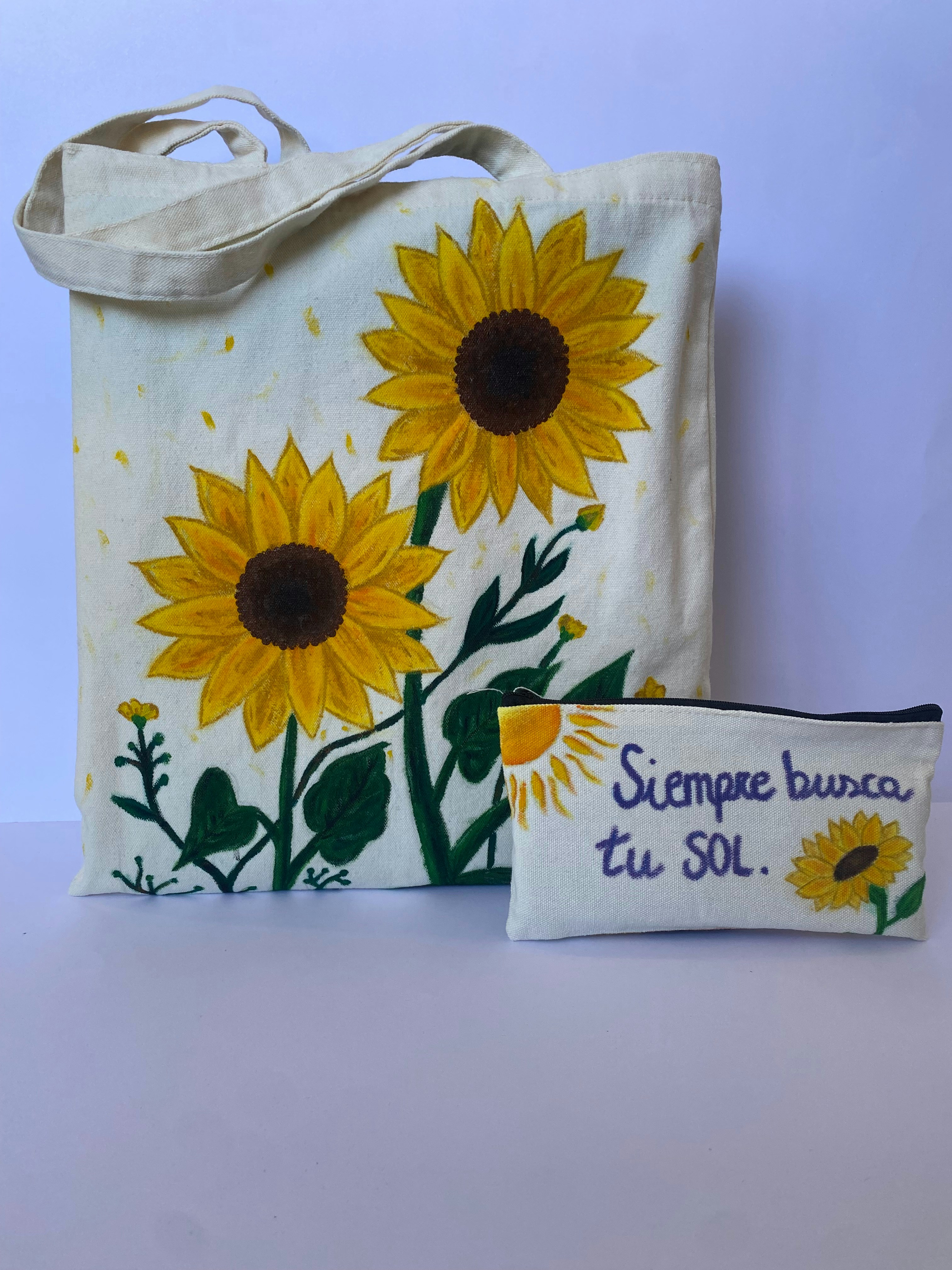 Hand-painted canvas tote bag with colorful flower designs on bright airy background