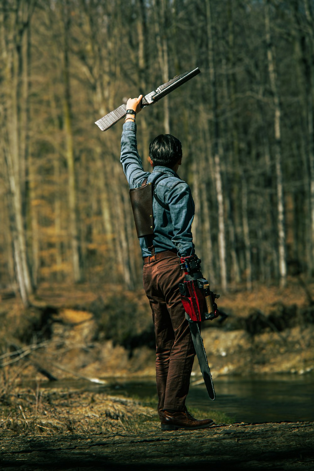 a man is holding a sword in the air