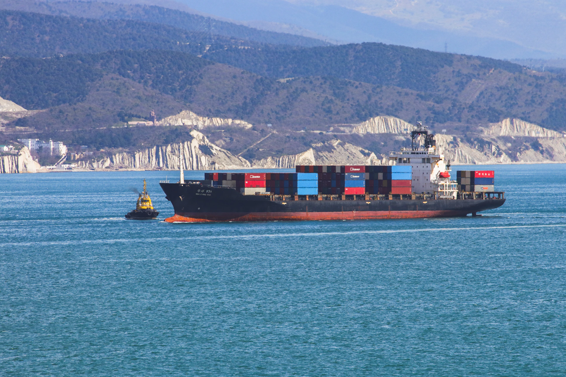 a large cargo ship sailing across a large body of water