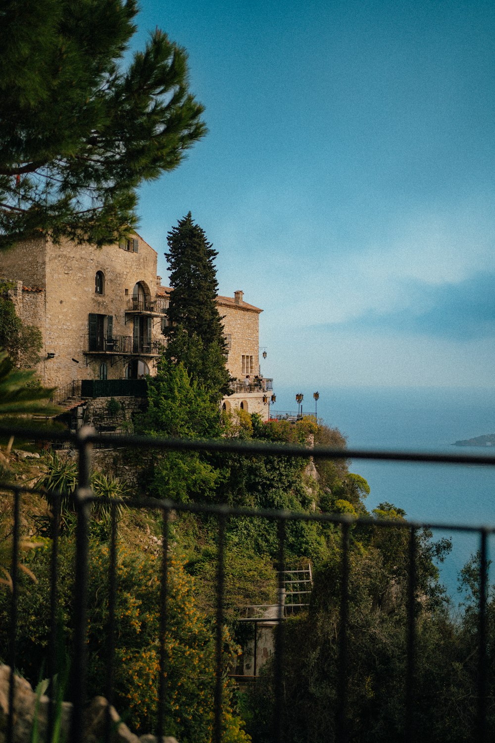 a house on a hill overlooking the ocean