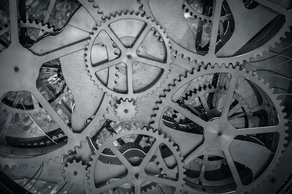 a close up of a clock with gears on it