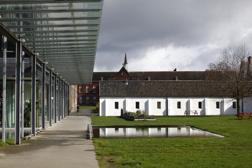 a building with a green lawn next to it