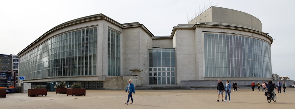 a group of people standing in front of a building